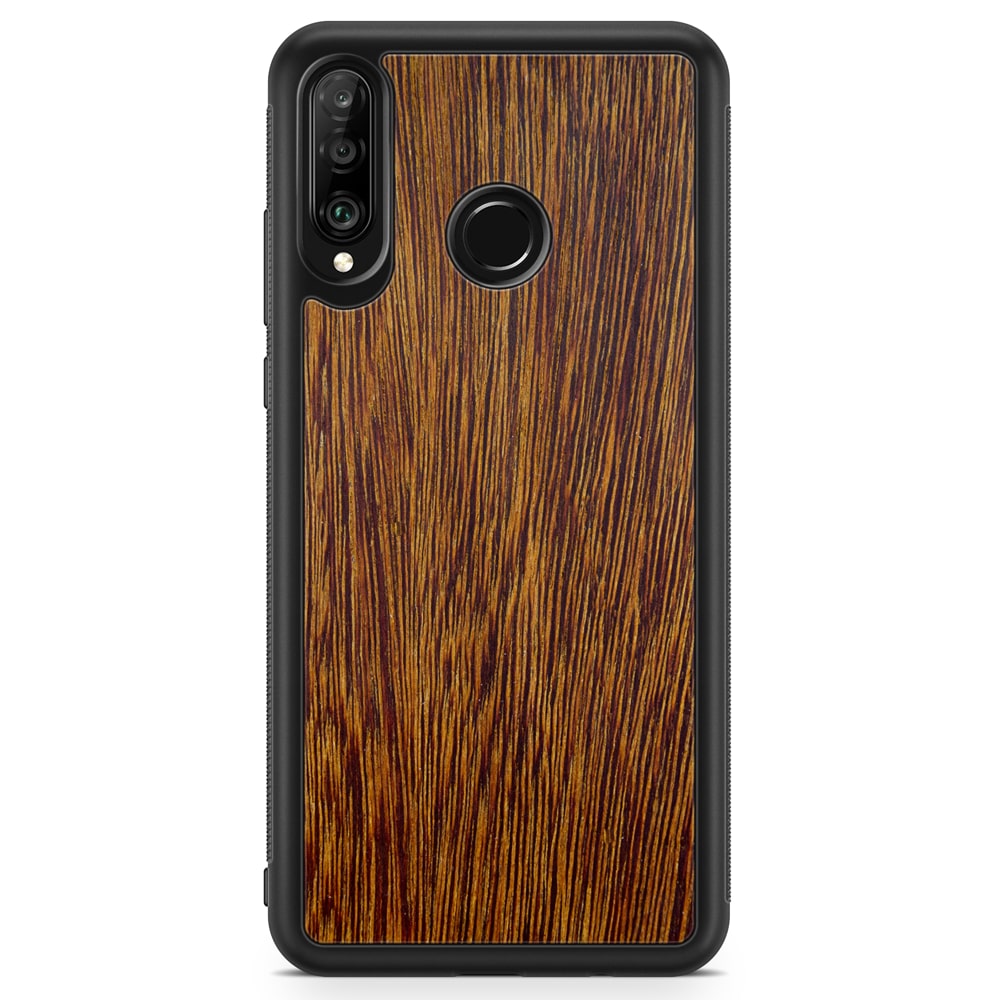 Sucupira wooden phone case held in hand, showcasing its unique grain and finish.