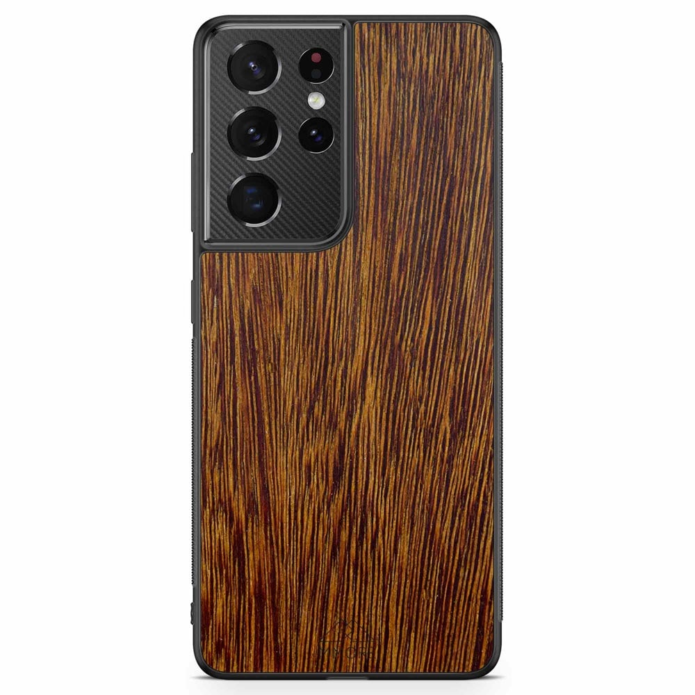 Sucupira wooden phone case held in hand, showcasing its unique grain and finish.