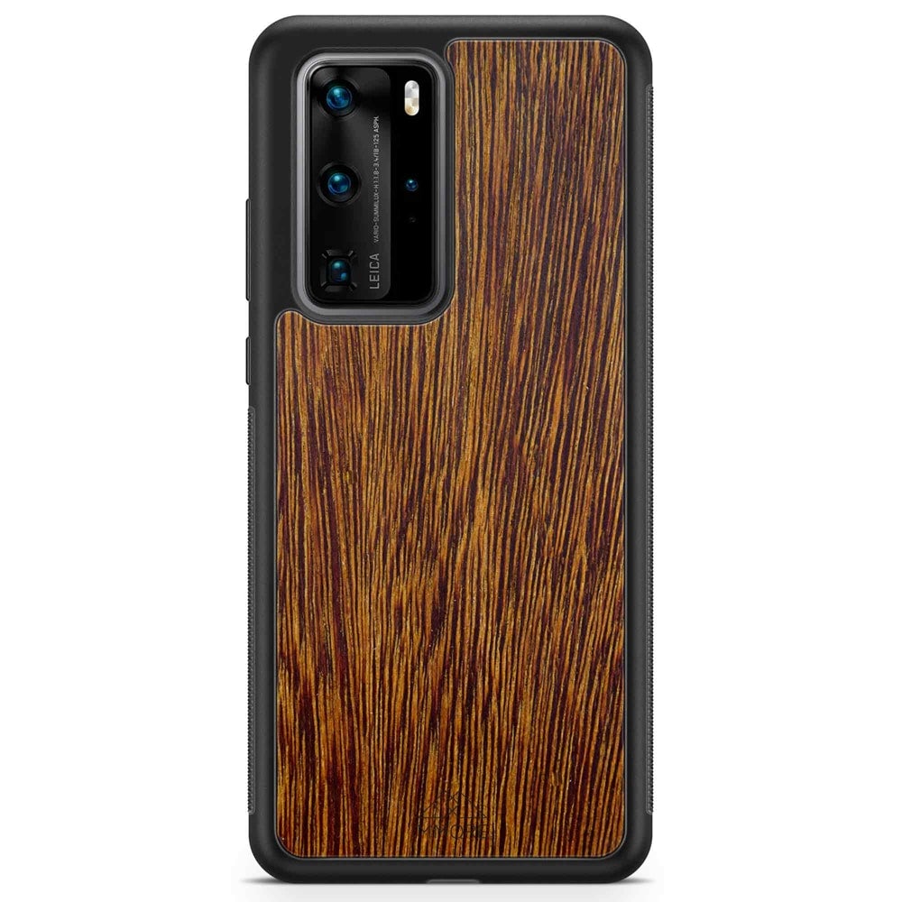 Sucupira wooden phone case held in hand, showcasing its unique grain and finish.