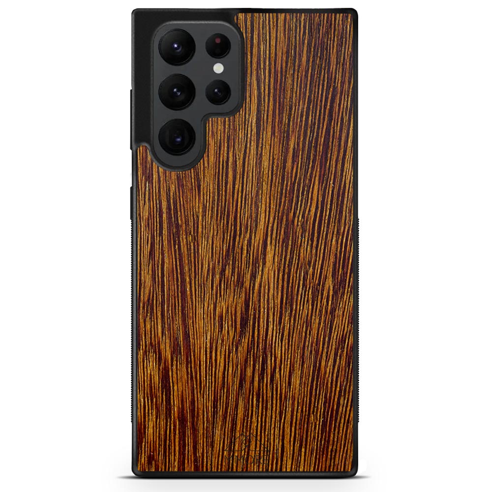 Sucupira wooden phone case held in hand, showcasing its unique grain and finish.