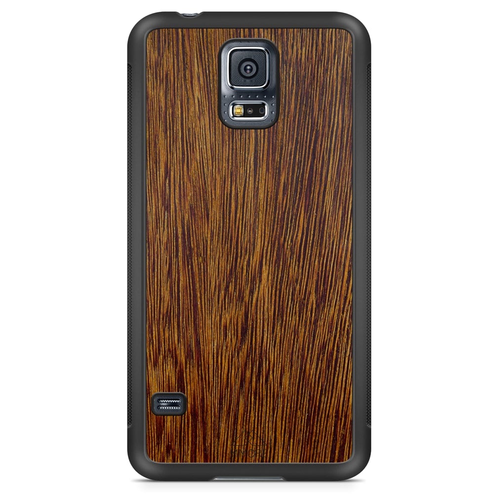 Sucupira wooden phone case held in hand, showcasing its unique grain and finish.