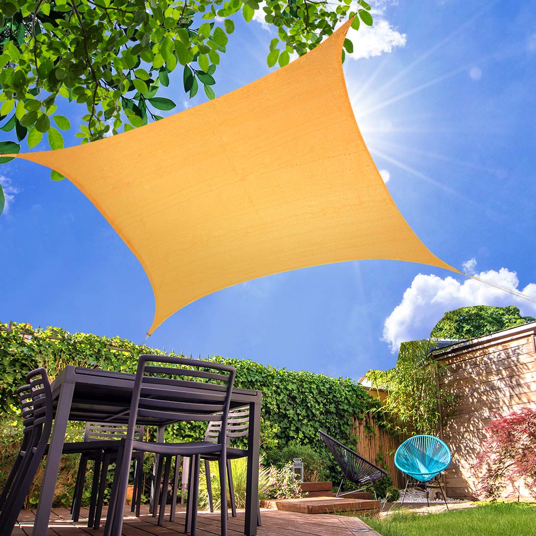 Sun Shade Sail Cloth Canopy in beige color, rectangular shape, providing shade outdoors with corner rings and strings for easy installation.