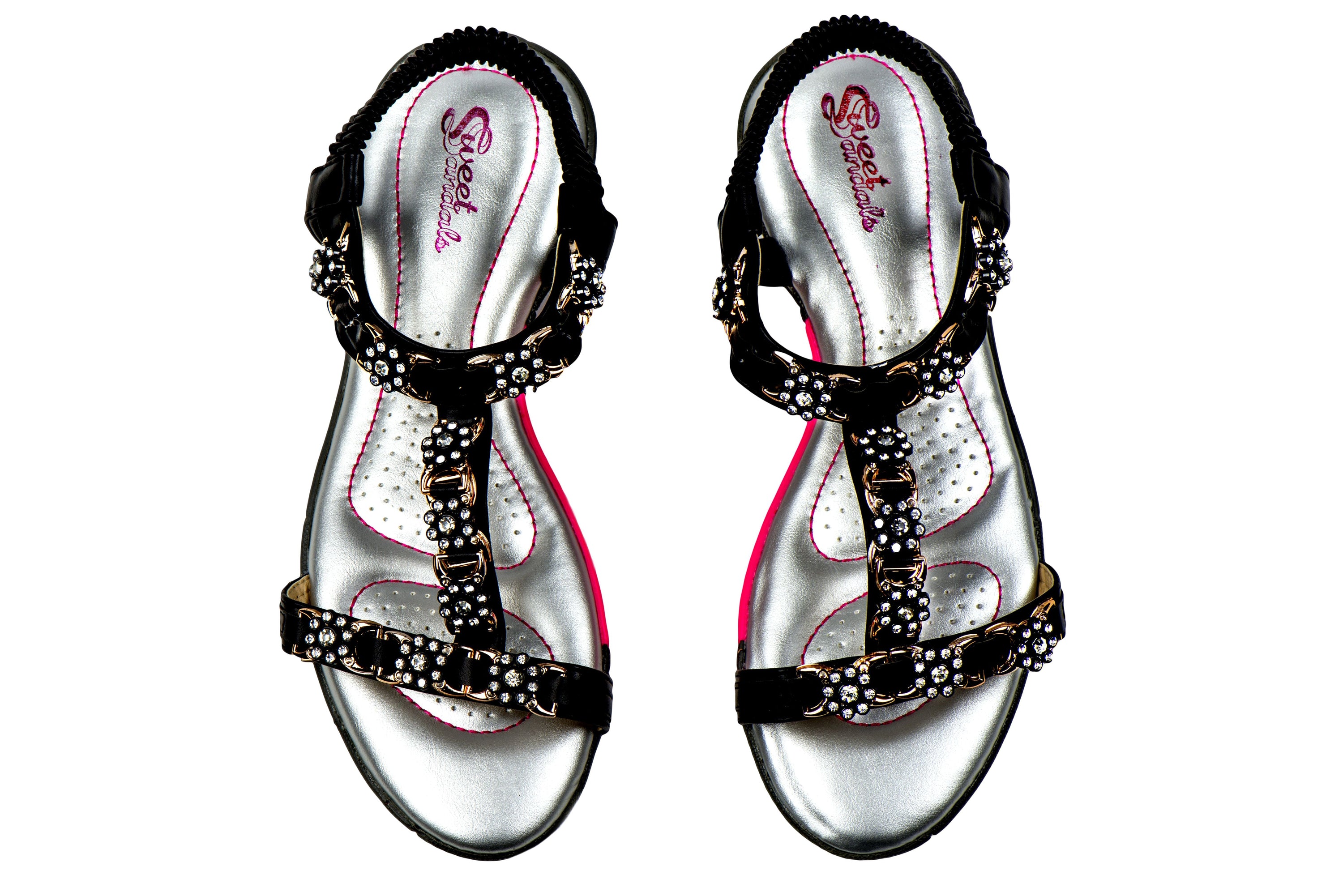 A pair of stylish Sweet Sandals featuring a slip-on design with pink stitching and faux jewel embellishments, perfect for golf or walking.