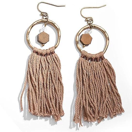 A pair of Tassela Trendy Earrings featuring olive and tan tassels, onyx and crystal accents, and a hammered gold finish.