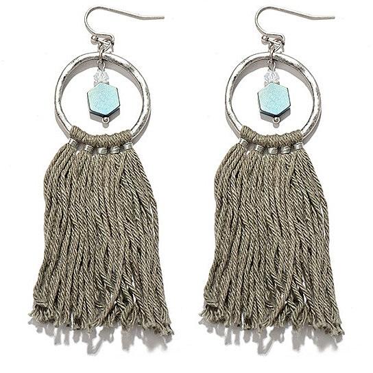 A pair of Tassela Trendy Earrings featuring olive and tan tassels, onyx and crystal accents, and a hammered gold finish.