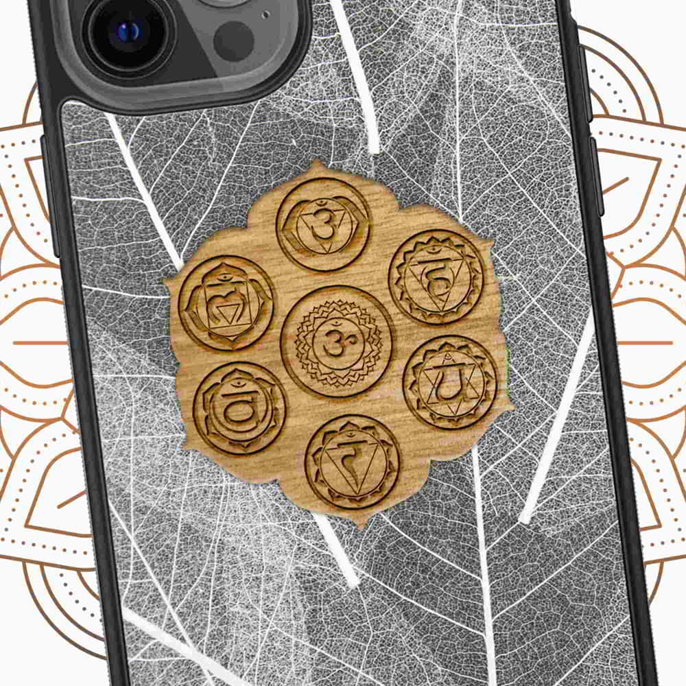 The Seven Chakra Symbols phone case featuring organic skeleton leaves, showcasing intricate leaf veins and chakra designs.