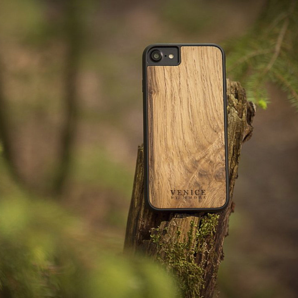 Handcrafted Venice case made from ancient oak wood with minimalist lettering design, showcasing its unique texture and craftsmanship.