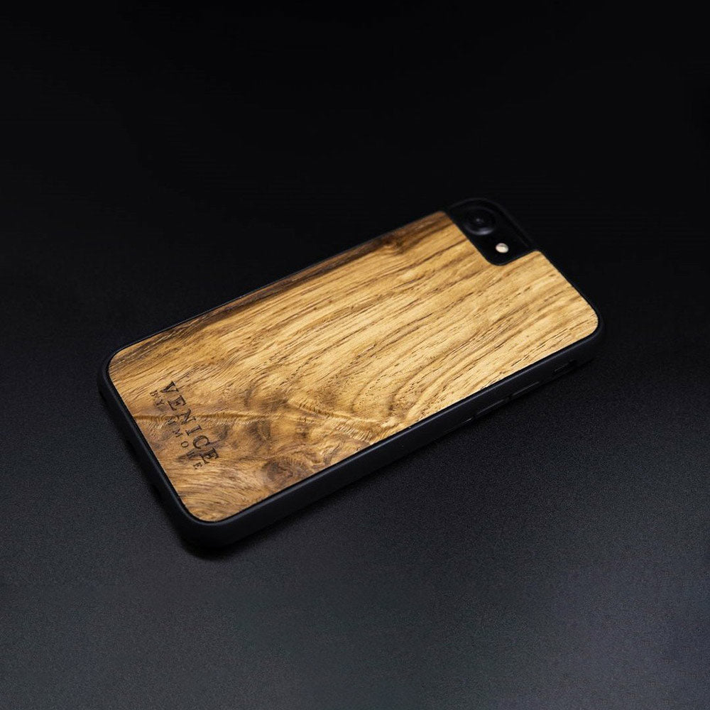 Handcrafted Venice case made from ancient oak wood with minimalist lettering design, showcasing its unique texture and craftsmanship.