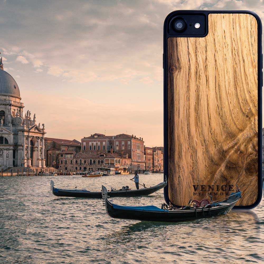 Handcrafted Venice case made from ancient oak wood with minimalist lettering design, showcasing its unique texture and craftsmanship.