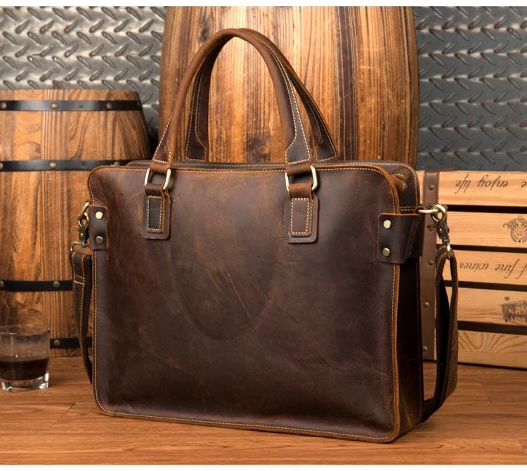 The Viggo Briefcase, a genuine leather messenger bag, showcasing its sleek design, spacious compartments, and high-quality crazy horse leather finish.