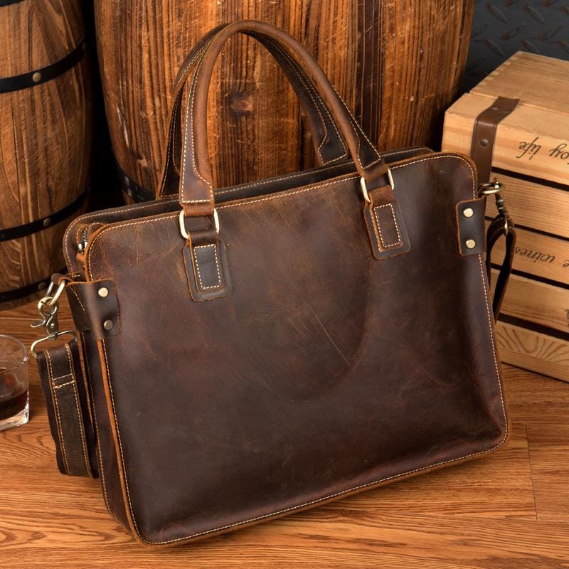 The Viggo Briefcase, a genuine leather messenger bag, showcasing its sleek design, spacious compartments, and high-quality crazy horse leather finish.