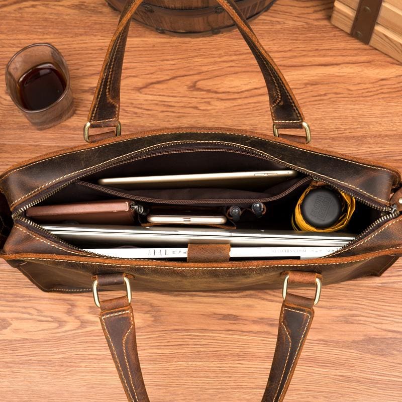 The Viggo Briefcase, a genuine leather messenger bag, showcasing its sleek design, spacious compartments, and high-quality crazy horse leather finish.