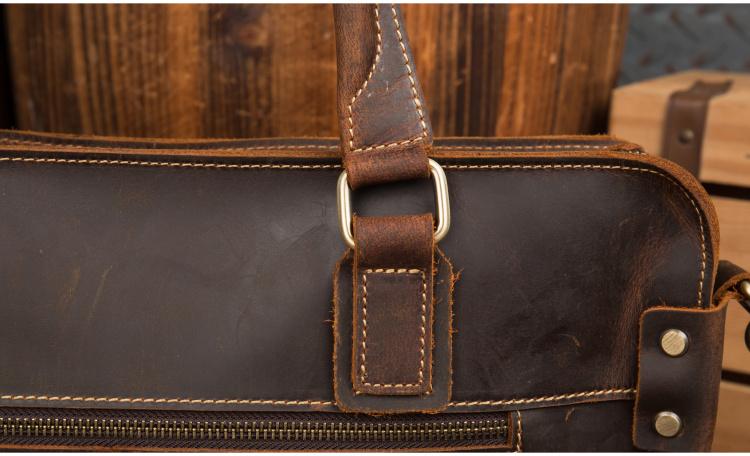 The Viggo Briefcase, a genuine leather messenger bag, showcasing its sleek design, spacious compartments, and high-quality crazy horse leather finish.