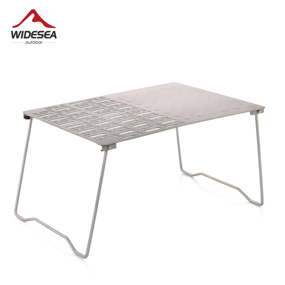 Titanium Charcoal BBQ Grill Net with folding legs, ideal for camping and beach picnics, showcasing its durable design and portability.