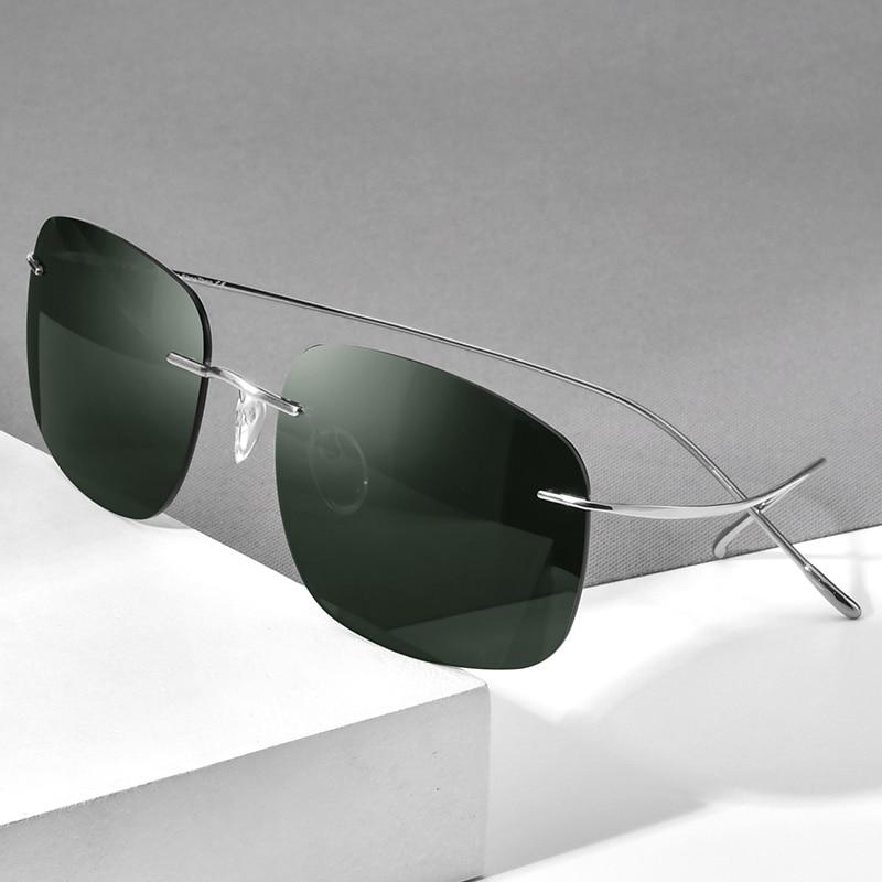 A pair of ultralight titanium rimless sunglasses for men, featuring polarized UV400 lenses and a stylish frameless design.