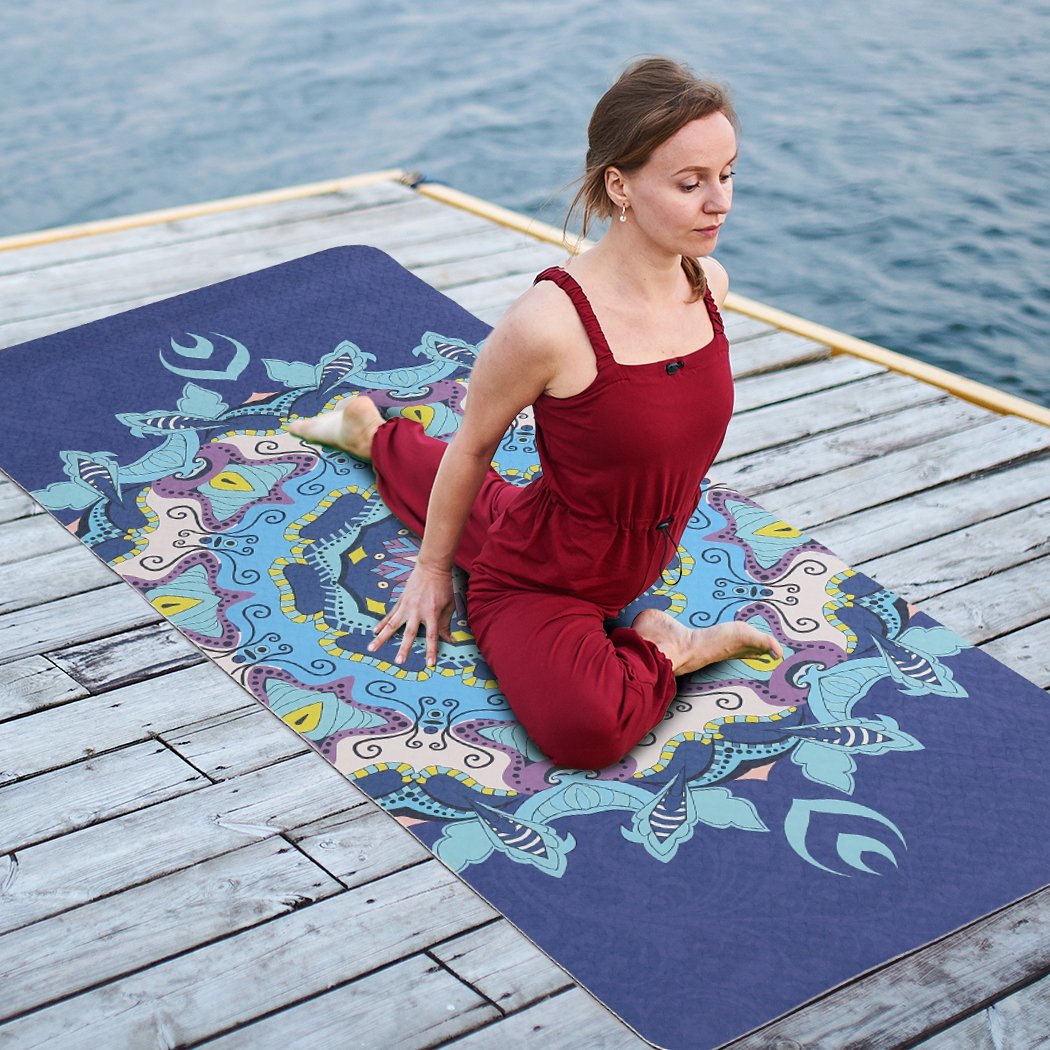 Eco-friendly TPE yoga mat with dual layer non-slip design, featuring traditional engravings and a bonus carry bag for easy transport.