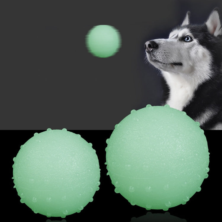 Large TPR Bite Resistant Luminous Bouncy Ball for dogs, glowing in the dark, showcasing its soft and elastic texture.