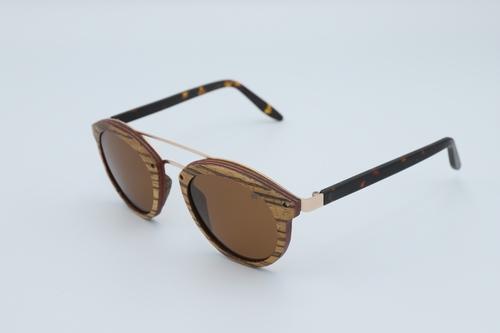 Stylish Trend Sunglasses made from zebra skateboard wood with brown polarized lenses and spring metal hinges, displayed in an eco-friendly wood box.