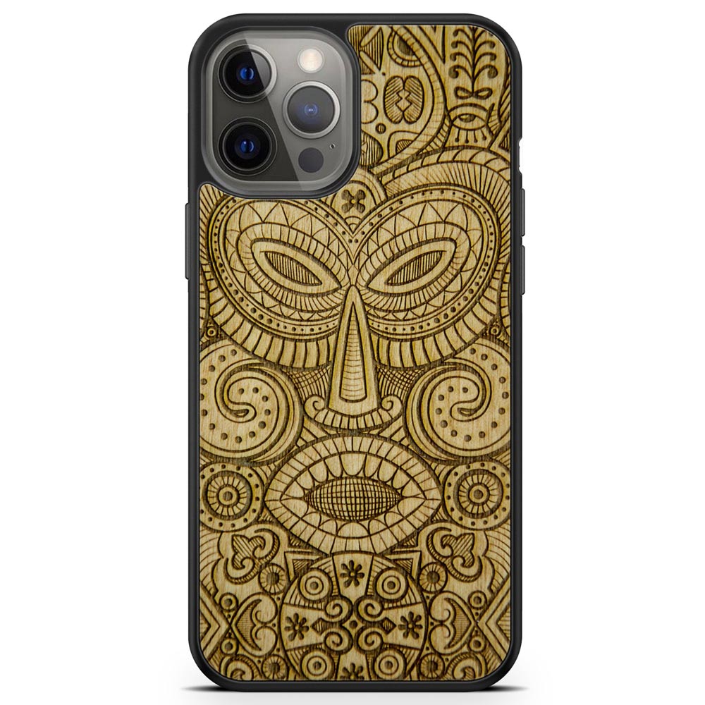 Tribal Mask wooden phone case held in hand, showcasing its unique design and natural wood grain.