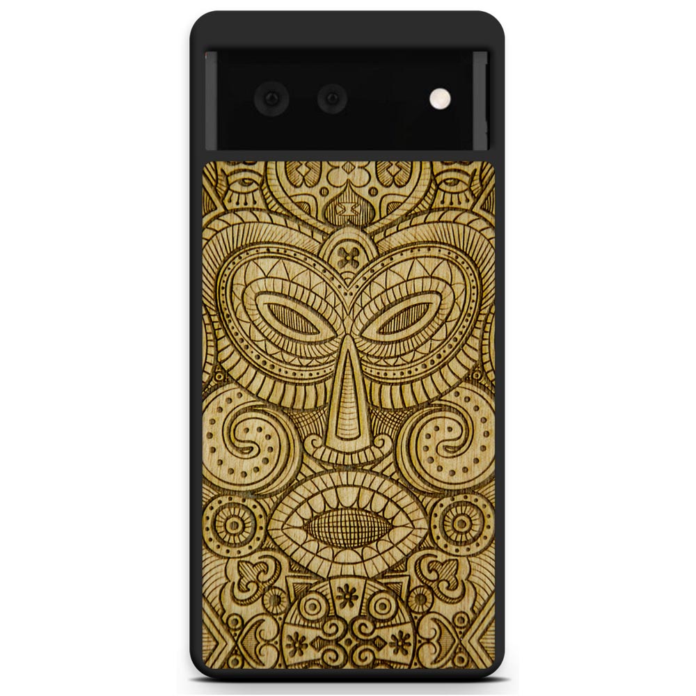 Tribal Mask wooden phone case held in hand, showcasing its unique design and natural wood grain.