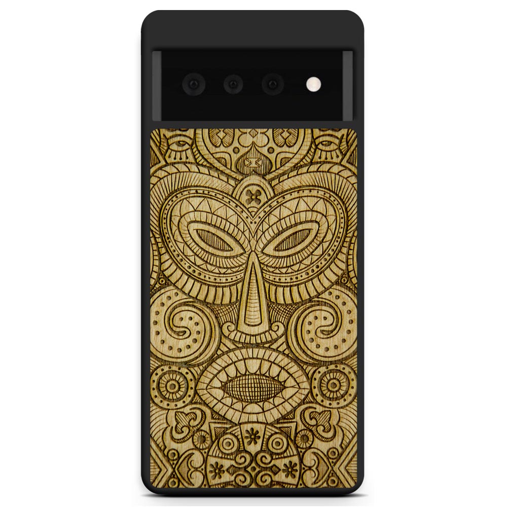 Tribal Mask wooden phone case held in hand, showcasing its unique design and natural wood grain.