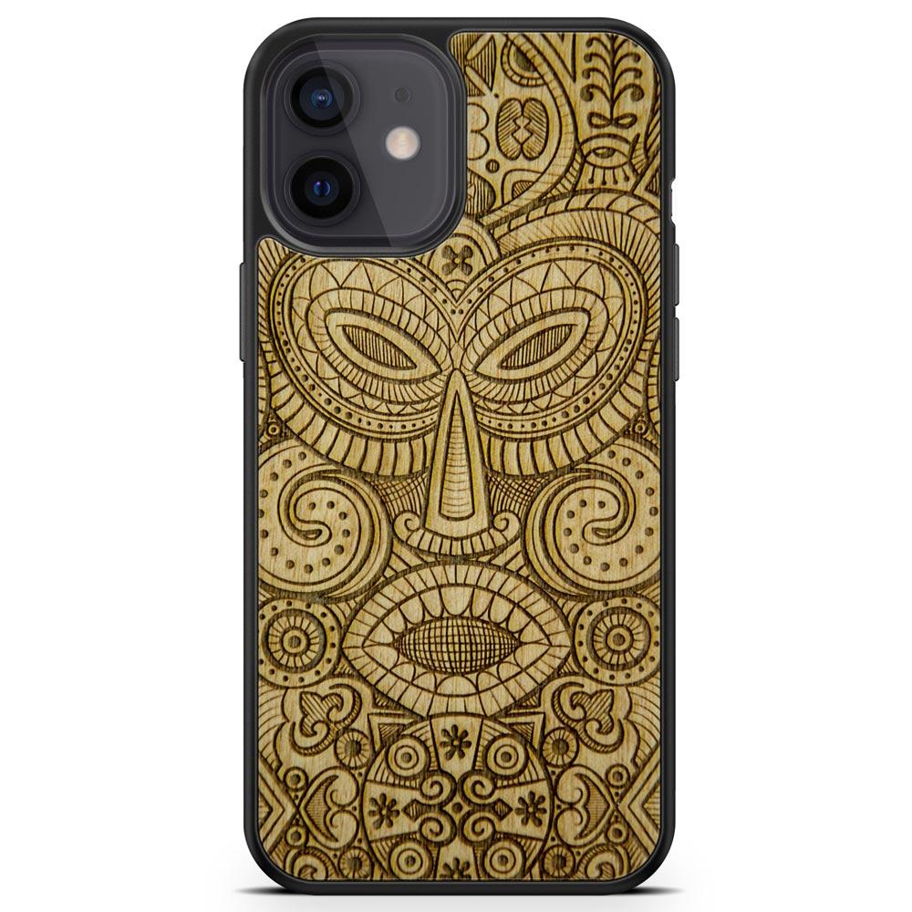 Tribal Mask wooden phone case held in hand, showcasing its unique design and natural wood grain.