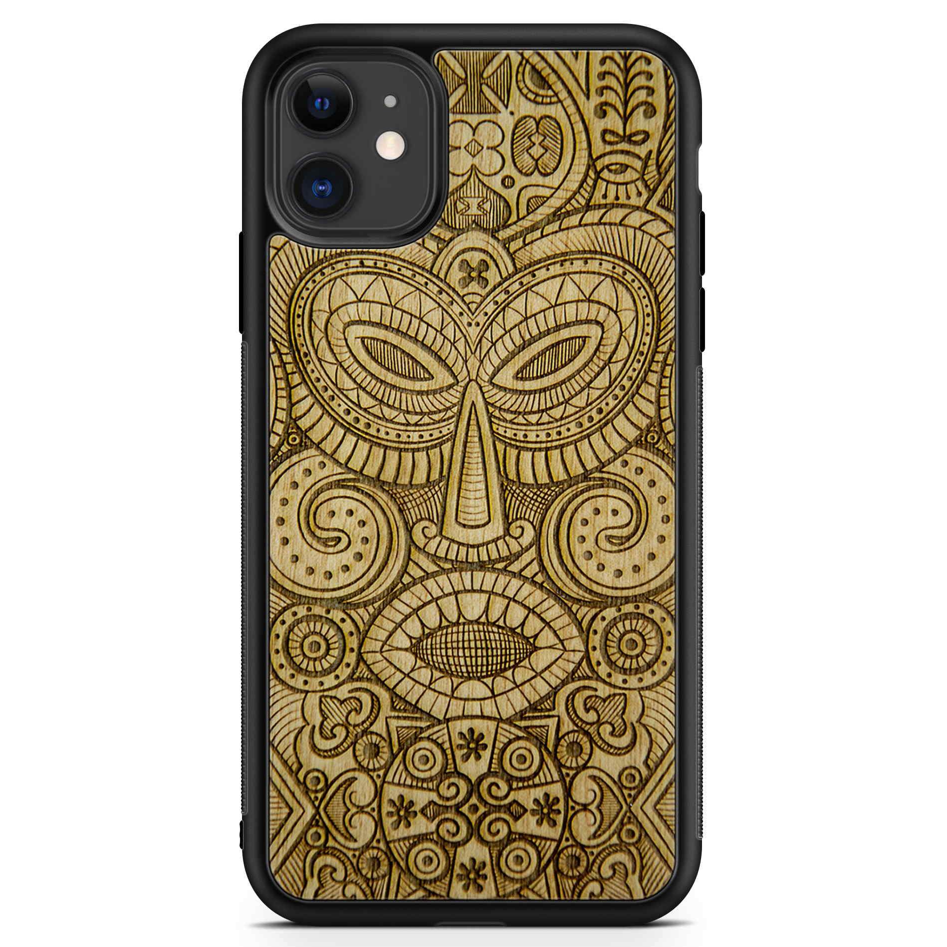 Tribal Mask wooden phone case held in hand, showcasing its unique design and natural wood grain.