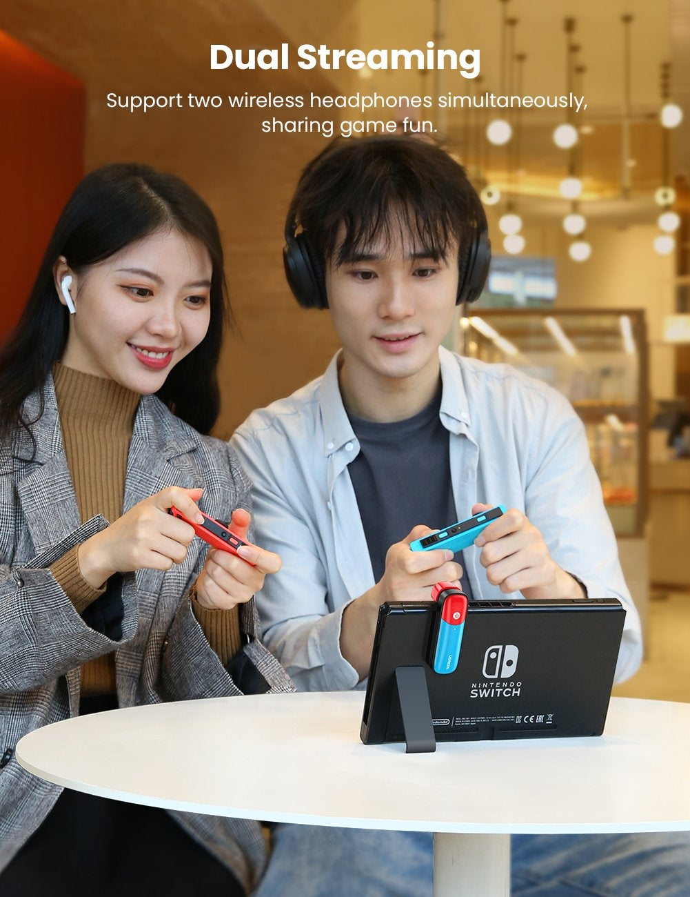 UGREEN 80188 Bluetooth 5.0 Switch Transmitter connected to Nintendo Switch, showcasing its sleek design and USB-C port.