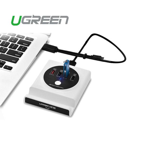 UGREEN Multifunction USB Charging Station with OTG USB Hub, featuring multiple USB ports and a cradle design for easy device viewing.