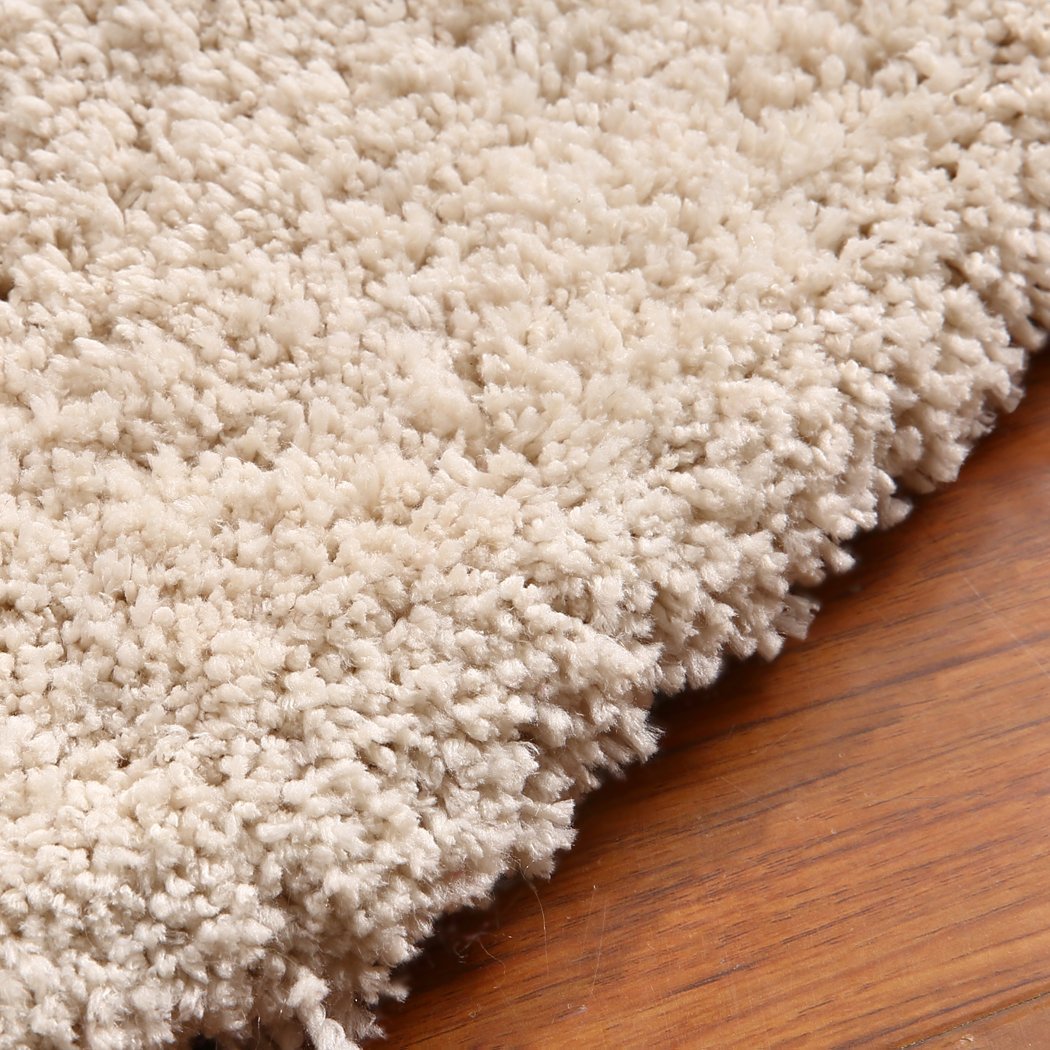 Ultra Soft Anti Slip Rectangle Plush Shaggy Floor Rug in Beige, showcasing its thick pile and non-slip backing, perfect for home decor.