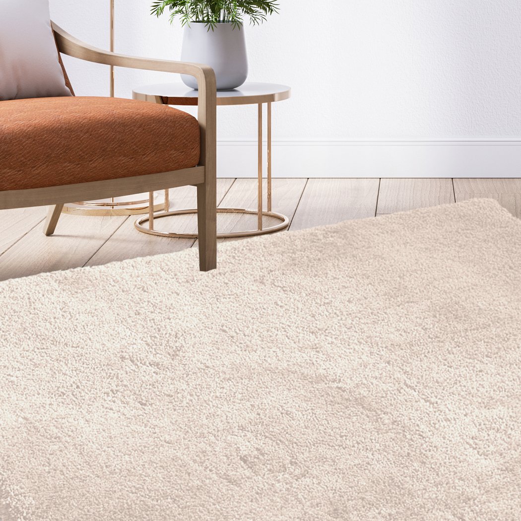 Ultra Soft Anti Slip Rectangle Plush Shaggy Floor Rug in Beige, showcasing its thick pile and non-slip backing, perfect for home decor.