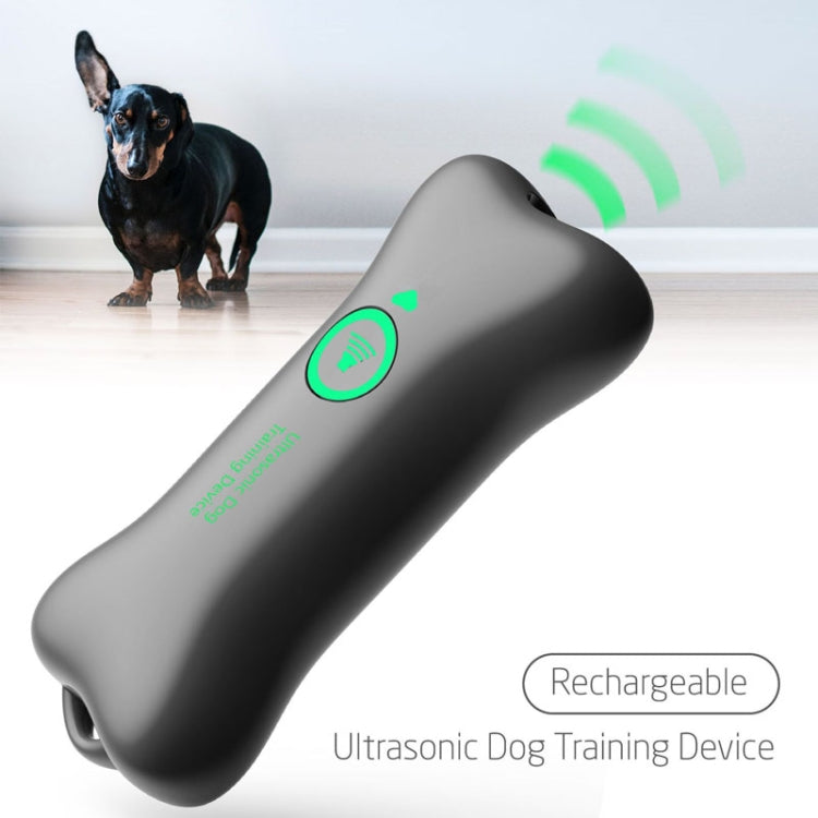 Ultrasonic Automatic Dog Barking Device in a handheld design, featuring a sleek surface with oil spray and night reflection for easy visibility.