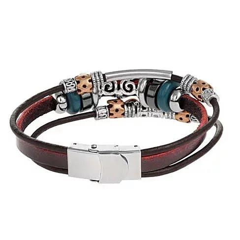 Unlock The Magic Bracelet featuring a brass key charm and ornate wheel beads in gold, silver, hematite, and teal wood, made from vegan leather.