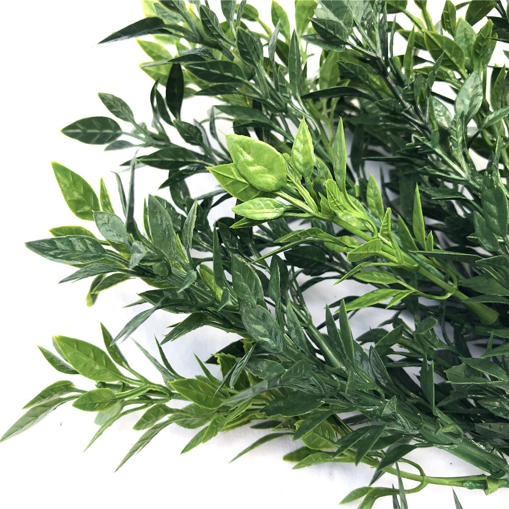 A 30cm UV Artificial Boxwood Stem featuring realistic foliage in various shades, ideal for outdoor decoration and green wall arrangements.