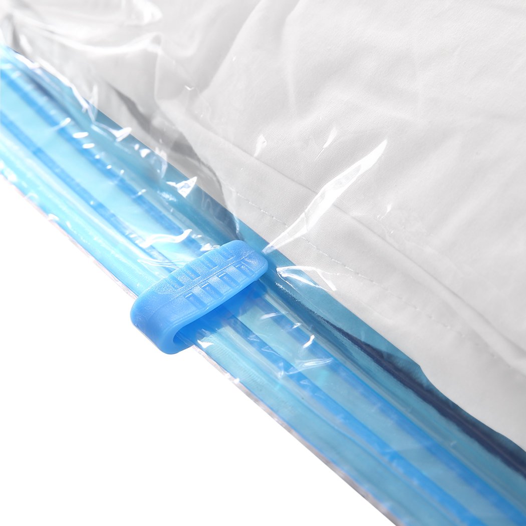 A set of transparent vacuum storage bags with an air pump, ideal for compressing clothes and quilts to save space.