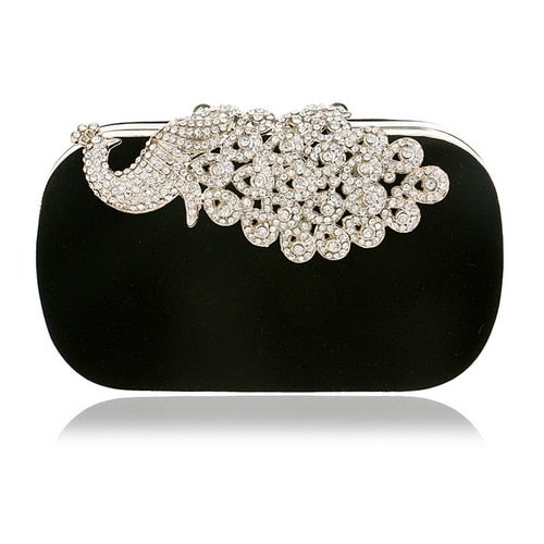 A luxurious velvet evening bag for women featuring a rhinestone flower design, perfect for parties and formal occasions.