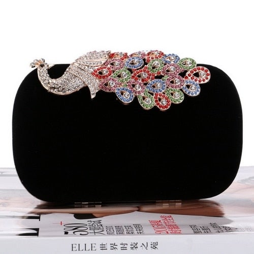 A luxurious velvet evening bag for women featuring a rhinestone flower design, perfect for parties and formal occasions.