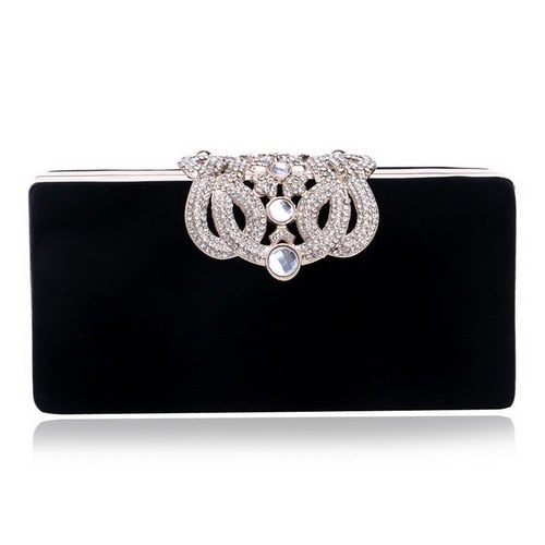 A luxurious velvet evening bag for women featuring a rhinestone flower design, perfect for parties and formal occasions.