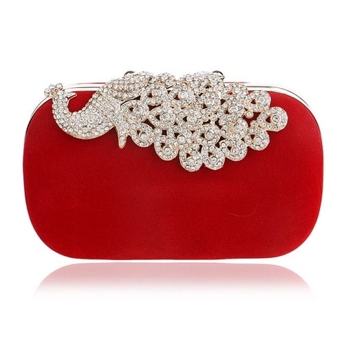 A luxurious velvet evening bag for women featuring a rhinestone flower design, perfect for parties and formal occasions.