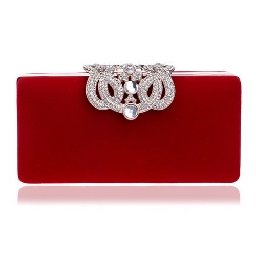 A luxurious velvet evening bag for women featuring a rhinestone flower design, perfect for parties and formal occasions.