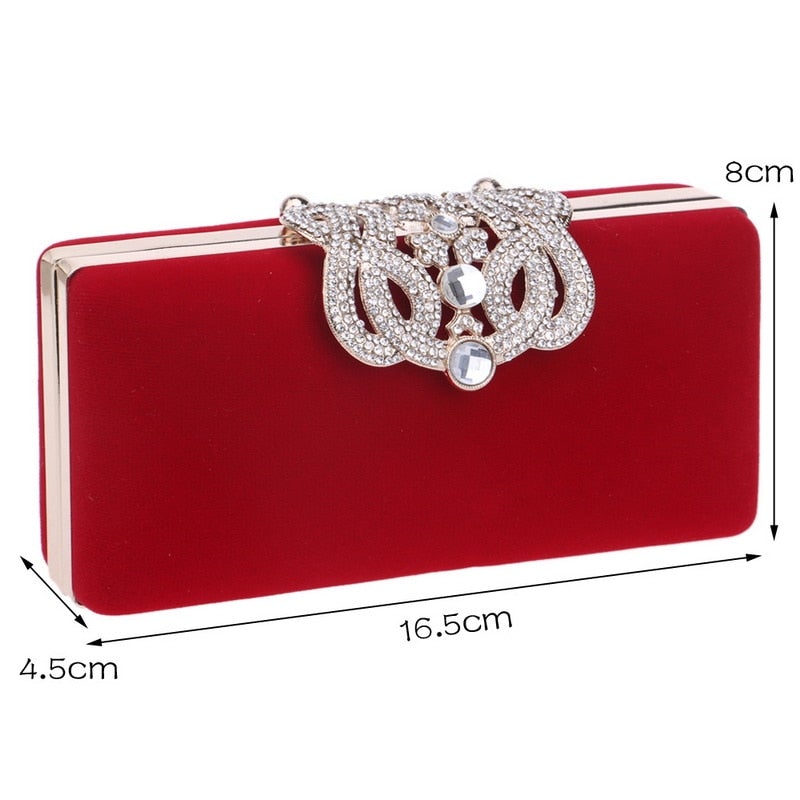 A luxurious velvet evening bag for women featuring a rhinestone flower design, perfect for parties and formal occasions.