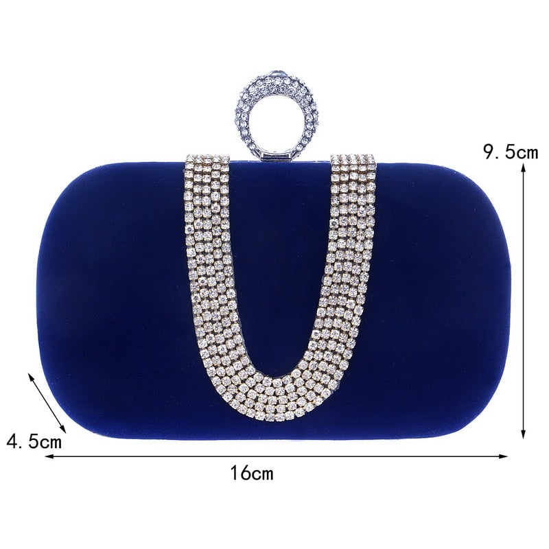 A luxurious velvet evening bag for women featuring a rhinestone flower design, perfect for parties and formal occasions.