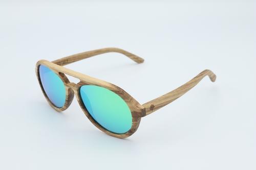 Vision Sunglasses made from premium zebra wood with green polarized lenses, displayed in a stylish wood box.