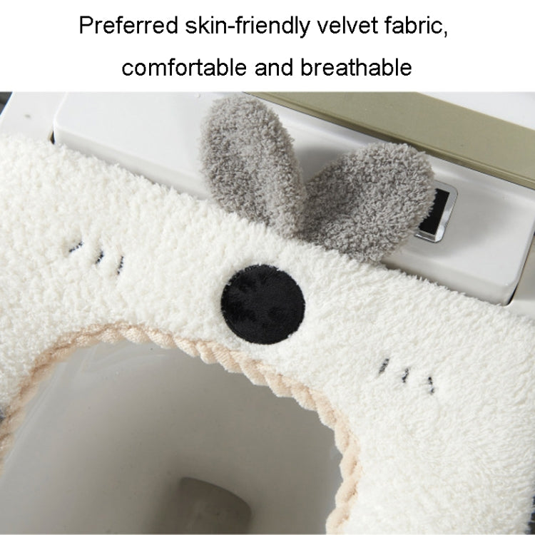 A colorful cartoon rabbit toilet seat cover made of soft coral velvet and leather, featuring a cute rabbit design and a convenient handle for easy lifting.