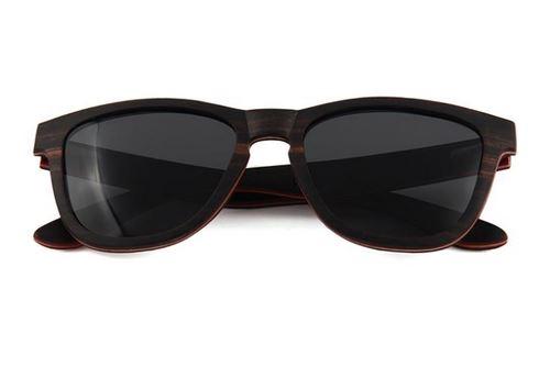 Wave Sunglasses made from skateboard wood with ebony frame and polarized lenses, displayed in a stylish wood box.