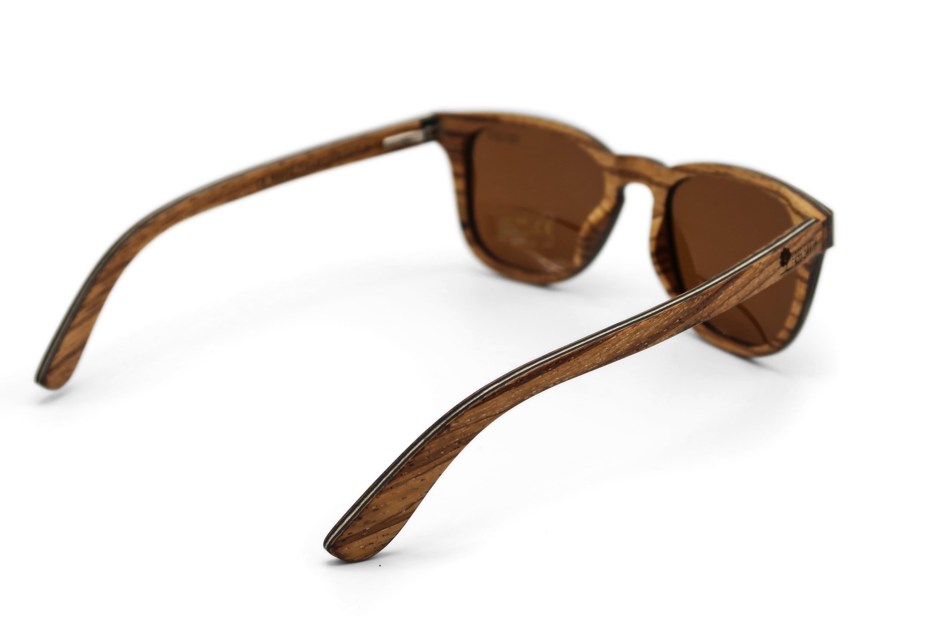 Wave Zebra Sunglasses featuring a unique zebra wood frame and polarized lenses, elegantly displayed in eco-friendly packaging.