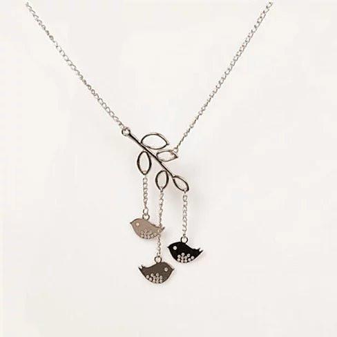 We R Family Necklace featuring three birds on a gold plated branch, symbolizing family unity and love.