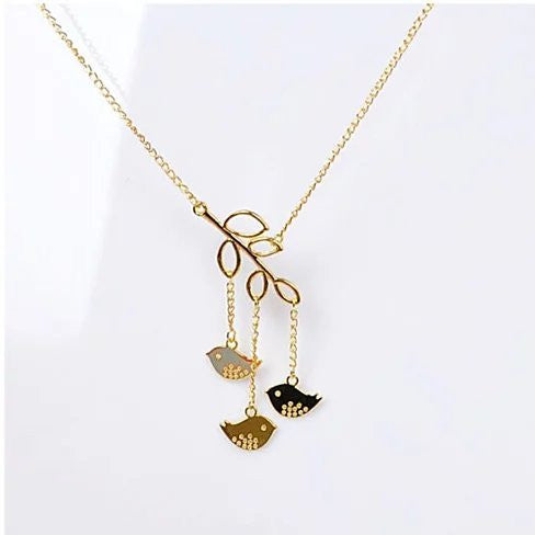 We R Family Necklace featuring three birds on a gold plated branch, symbolizing family unity and love.