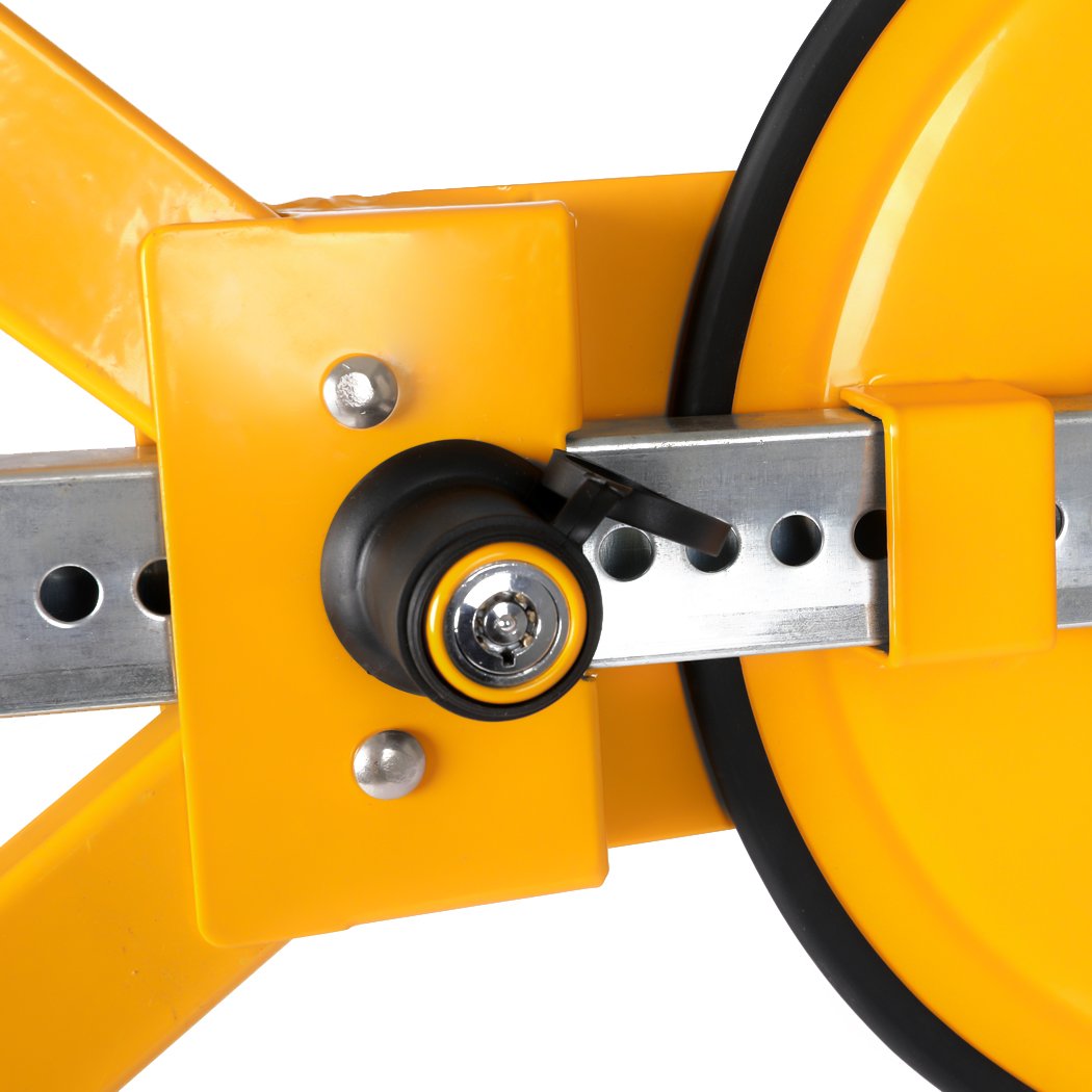 Heavy-duty yellow wheel lock clamp designed for vehicle security, featuring an adjustable locking system and two keys.