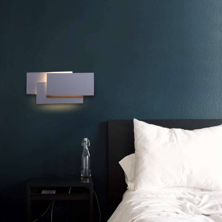 White square 18W LED wall lamp designed for bedrooms and living rooms, featuring a sleek aluminum shade and compact dimensions.